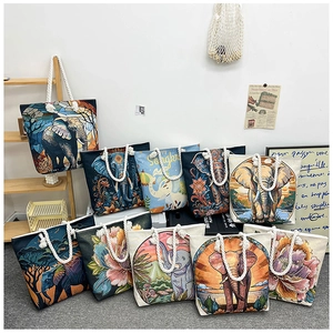Detail of colorful tote bag featuring elephant embroidery and thick cotton rope handles