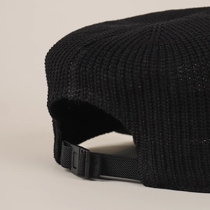 Adjustable black knit baseball cap with breathable texture and buckle strap detail