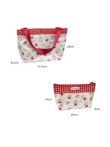 Detail view of cherry print PVC tote bag and zipper pouch set with red plaid trim