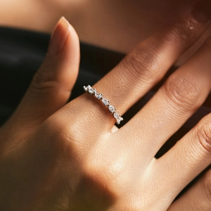 Elegant S925 silver ring with teardrop zirconia stones on a female hand model