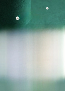 Detail of silver chain ring with a round mint green gemstone on a dark green background
