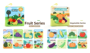 Detail of baby cloth books featuring fruit and vegetable patterns with hanging rings