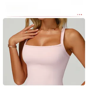 Detail of light pink sports tank top featuring removable padding for comfort
