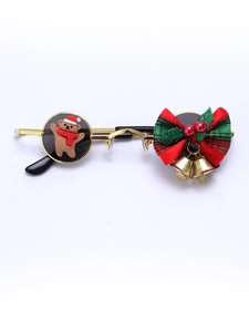 Close-up of Christmas sunglasses with gold frame, cute bear and festive bow details