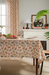 Detailed Christmas tablecloth scene with gingerbread man print and festive decor