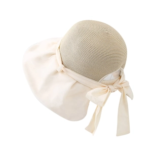Women's wide brim sun hat with straw crown and elegant beige fabric bow detail