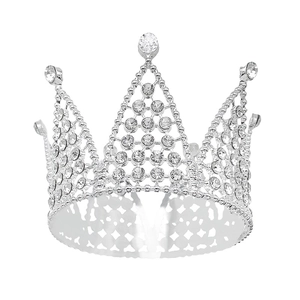 Silver crown cake topper with sparkling crystals on metal frame for birthday parties
