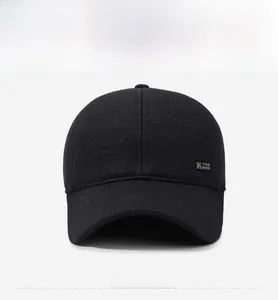 Close-up of a 1988 metal badge on a thick black winter baseball cap for men