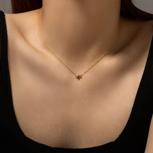 Elegant gold S925 sterling silver necklace with sparkling three-leaf clover pendant on model