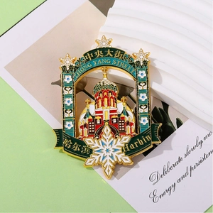 Close-up of Saint Sophia Cathedral metal badge with snowflake detail and gold finish