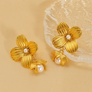 Elegant gold flower pearl drop earrings with textured petals and retro French design