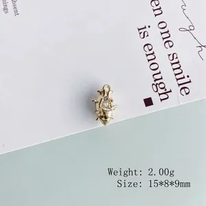Detailed view of a gold animal pendant with crystals, size 15x8x9mm and weight 2.00g