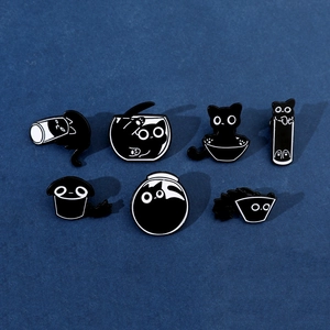 Set of seven funny black cat enamel pins showing various cartoon cats in glass containers