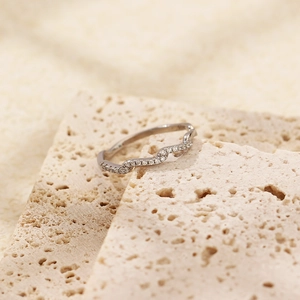Minimalist S925 sterling silver wavy ring with small diamonds on a beige stone