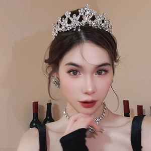 Detail of luxury rhinestone floral crown set with matching earrings and necklace
