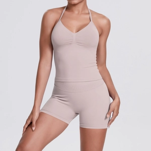 Close-up of seamless knitted yoga set featuring halter sports bra and high-waist shorts