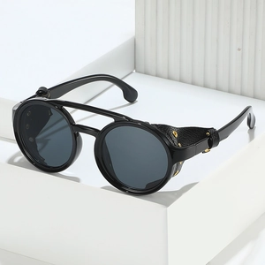 Retro steampunk round sunglasses in black with leather side shields and gold metal eyelets