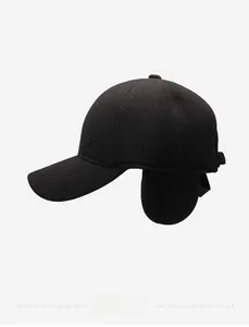 Detail view of winter woolen baseball cap with folding ear flaps and metal K logo