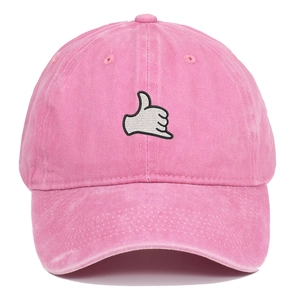 Detail of pink washed cotton baseball cap featuring white gesture embroidery on the front