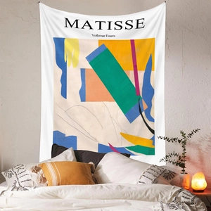 Detail view of Matisse geometric art tapestry hanging over a bed in a cozy bedroom