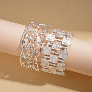 18K gold plated silver bangles featuring irregular hollow lines and spiral pattern