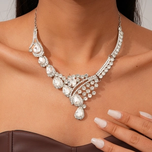 Close-up of teardrop diamond pendant necklace with shimmering silver-tone rhinestones