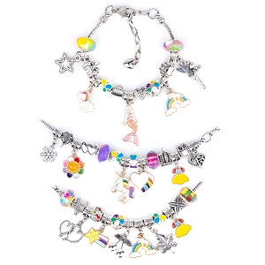 Detailed view of three silver plated charm bracelets with colorful ocean themed pendants