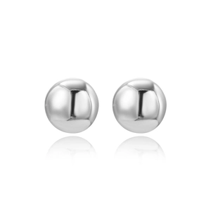 Close-up of spherical silver stud earrings with high-polish metallic mirror finish