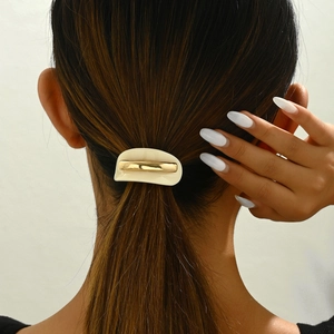Elegant French acetate ponytail holder with gold metal bar in creamy white finish