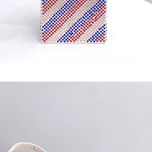Close-up of sparkling red, white, and blue rhinestone stripes on a stylish evening clutch bag