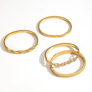 Set of four 18k gold plated stainless steel bracelets with sparkling zircon crystal accents