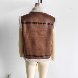 Detailed back view of brown faux suede vest with white faux fur lining and horizontal trim