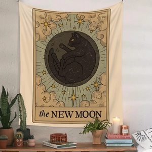 Bohemian black cat and new moon tarot tapestry hanging on a white wall for room decor