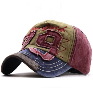 Detail of vintage patchwork baseball cap with New York embroidery and 19 applique