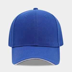 Detail of royal blue cotton baseball cap with ventilation eyelets and curved brim
