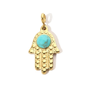 Detailed view of a golden Hamsa hand pendant with a central turquoise stone inlay