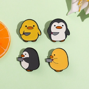 Funny cartoon yellow duck and penguin enamel pin set with knife for clothing and bags