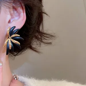 Elegant 18k gold plated leaf stud earrings featuring vintage black and gold floral design
