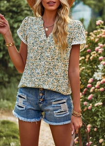Detailed close-up of floral short sleeve shirt featuring delicate lace trim on the cuffs