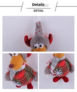 Close-up of reindeer plush ornament showing knitted heart patterns and plaid fabric details