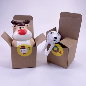 Close-up of Christmas countdown gift boxes with reindeer and dog toys for blind box set