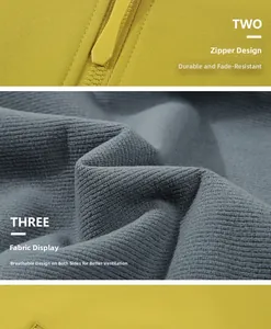 Detail of durable yellow zipper and breathable striped fabric on a softshell outdoor jacket