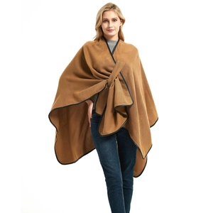 Women's solid camel knit shawl poncho with faux leather trim and cross front buckle