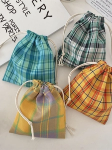 Set of four colorful plaid drawstring pouches in blue, green, and orange cotton fabrics