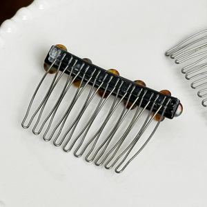 Floral acetate hair comb with rhinestone inlay and amber accents for elegant hair styling