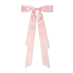 Detail of pink satin bow hair clip with long ribbons on a white background