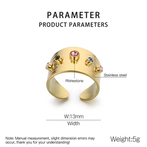 Detailed view of 13mm wide gold stainless steel ring with colorful cubic zirconia