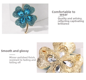 Detail of four-leaf clover brooch showing blue crystals and gold mirror-polished back
