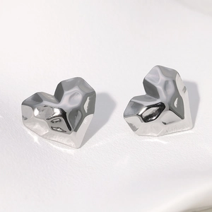 Minimalist silver heart earrings with textured geometric hammered surface finish