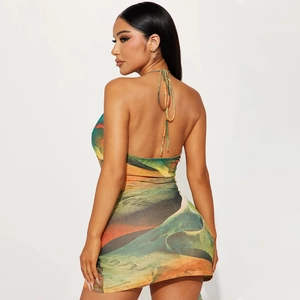 Detail view of the backless tie-up design and abstract print on a summer dress